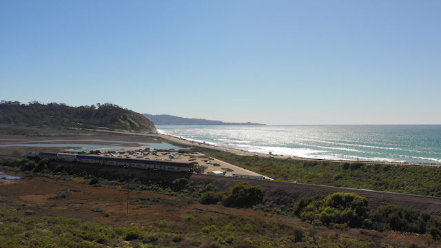 Elevated view of the cliffs, the surf and the ocean in Del Mar.