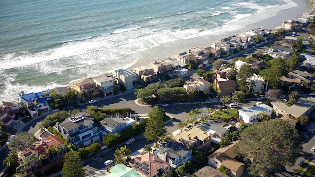 Orbit Reveal shot of Solana Beach and the beautiful homes by the shore | Drone Video