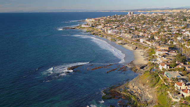 Aerial view of the beach, the ocean and homes at Windansea.
