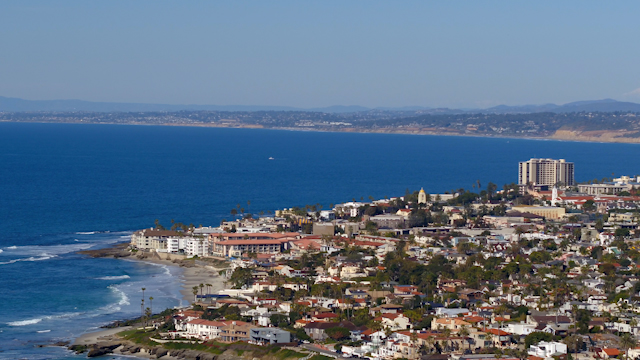 Aerial view of a residential street, the ocean and homes at Windansea.