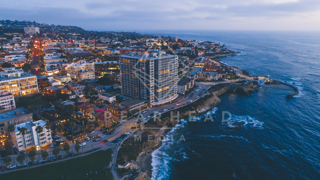Aerial view of the downtown streets, the ocean and homes at La Jolla Cove.