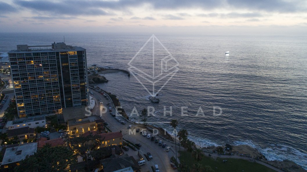 Aerial view of the cliffs, boats and the ocean at La Jolla Cove.