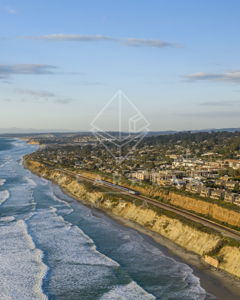 Aerial view of the cliffs, the surf and the ocean in Del Mar.