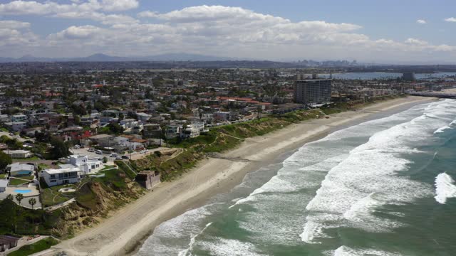 Aerial view of the beach, the surf and the ocean in Pacific Beach.