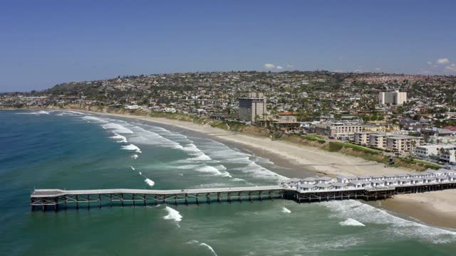 Aerial view of the beach, the surf and the pier in Pacific Beach.