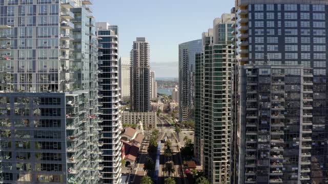 Aerial view of the downtown streets, the skyline and palm trees at Waterfront.