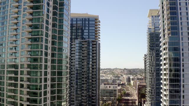 Low aerial view of the downtown streets, the skyline and the buildings at Waterfront.
