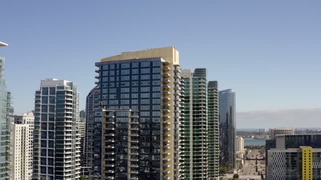 Low aerial view of the downtown streets, the skyline and the buildings at Waterfront.