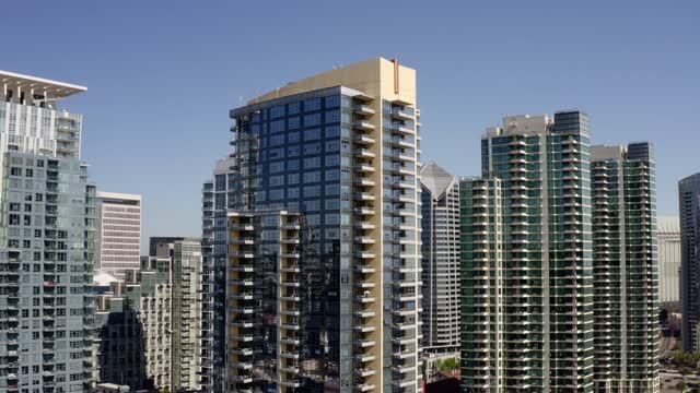 Low aerial view of the downtown streets, the skyline and the buildings at Waterfront.