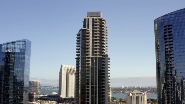 Low aerial view of the downtown streets, the skyline and the bay at Waterfront.