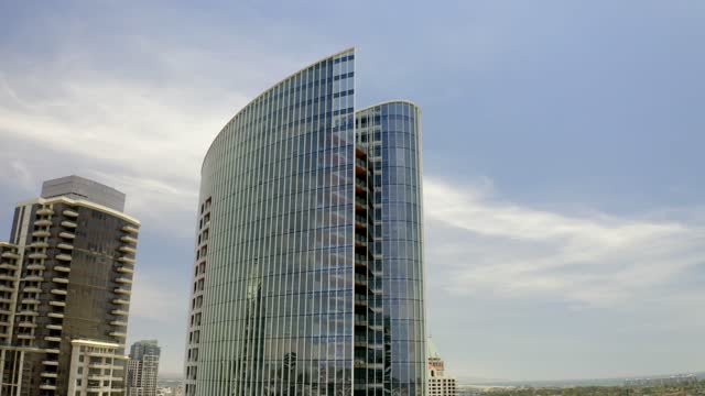 Low aerial view of the downtown streets, the skyline and the buildings at Waterfront.