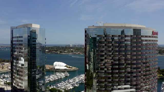 Low aerial view of the downtown streets, boats and the bay at Marina.
