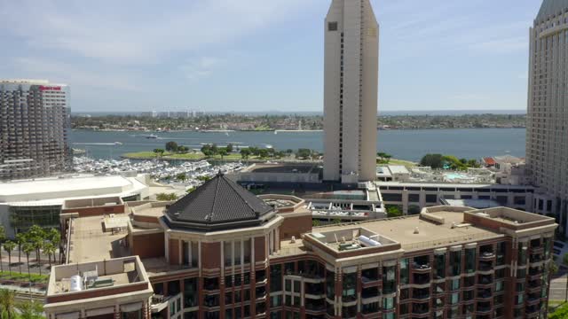 Aerial view of the downtown streets, the skyline and boats at Marina, with boats out.