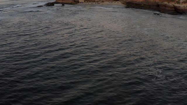 Aerial view of the cliffs, the ocean and open country at La Jolla Cove.