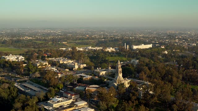 Aerial view of a park, the skyline and palm trees in Balboa Park.