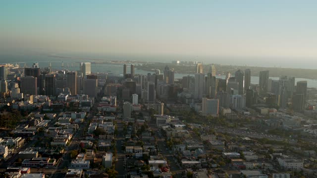 Aerial view of the downtown streets, the bridge and the skyline in Downtown San Diego.