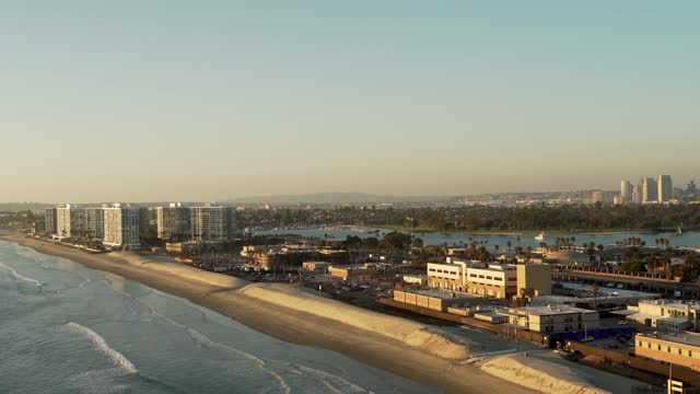 Aerial view of the beach, the skyline and boats at Coronado Beach.