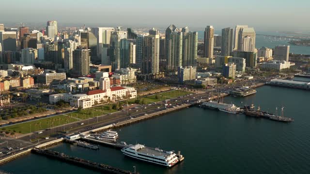 Aerial view of the downtown streets, the skyline and boats at Marina, with boats out.