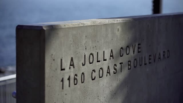 Close view of the cliffs, the ocean and the water at La Jolla Cove.