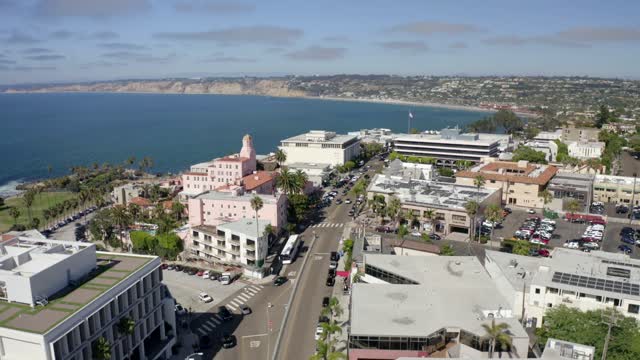 Aerial view of the downtown streets, palm trees and the ocean at La Jolla Village.
