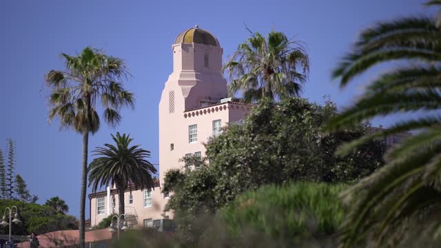 The downtown streets, palm trees and the buildings at La Jolla Cove.