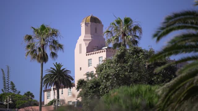 The downtown streets, palm trees and the buildings at La Jolla Cove.