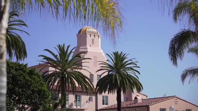 The downtown streets, palm trees and the buildings at La Jolla Cove.