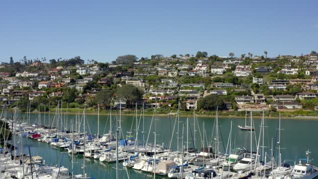 Low aerial view of the harbor, boats and the bay in Point Loma.
