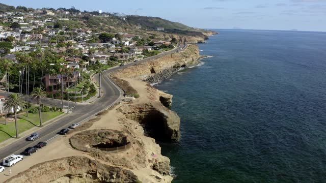 Aerial view of the cliffs, palm trees and the ocean at Sunset Cliffs.