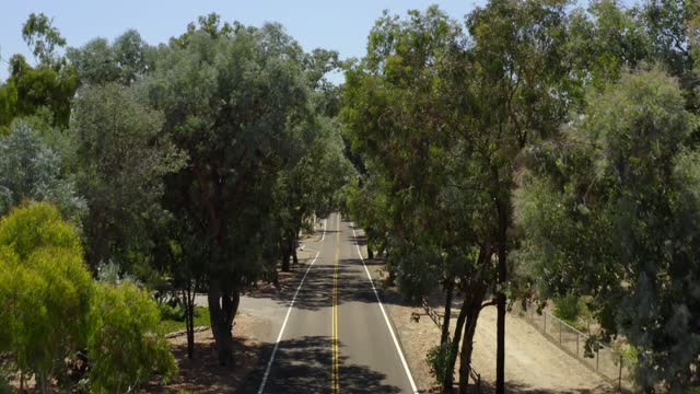 Low aerial view of the country inland, traffic and open country in Rancho Santa Fe.