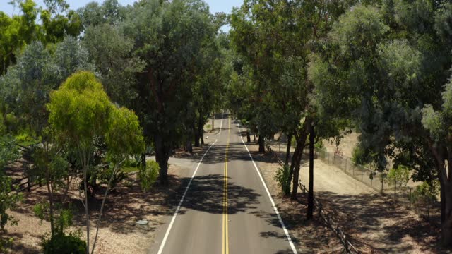 Low aerial view of the country inland, traffic and open country in Rancho Santa Fe.