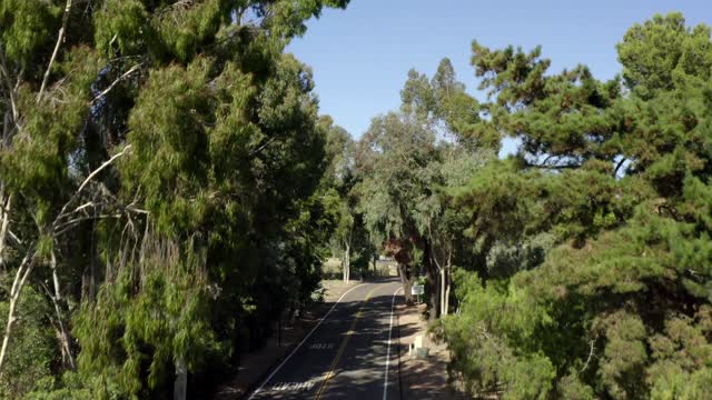 A residential street, homes and open country in Rancho Santa Fe.