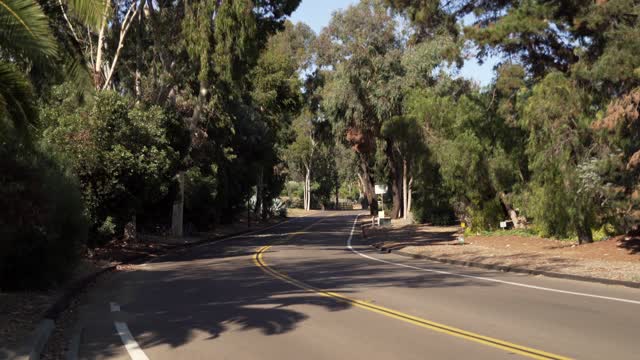 A residential street, traffic and open country in Rancho Santa Fe.