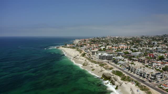 Aerial view of the beach, the ocean and homes at Windansea.