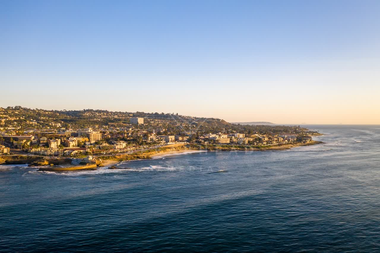 Aerial view of the cliffs, the ocean and homes at La Jolla Cove.