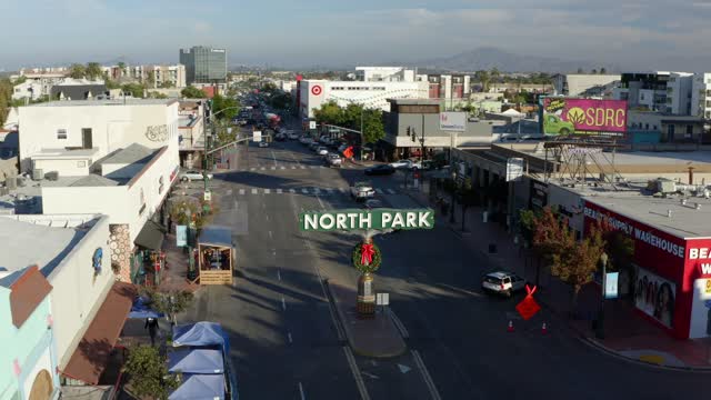 Low aerial view of the downtown streets, the buildings and the city in North Park.