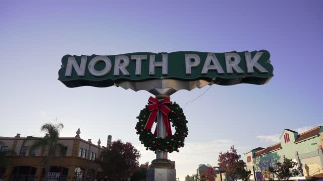 The North Park Sign with a Christmas wreath on University Avenue | Video – 3