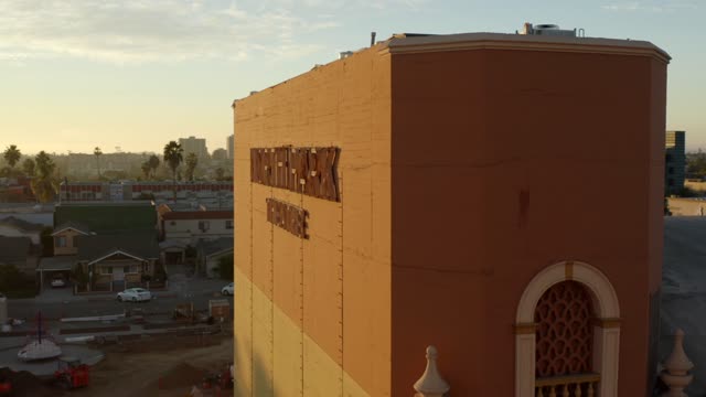 Low aerial view of the downtown streets, the skyline and palm trees in North Park.