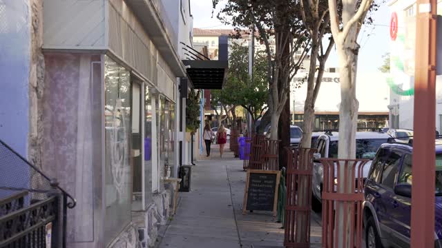 The downtown streets, the buildings and the city in North Park, with people walking.