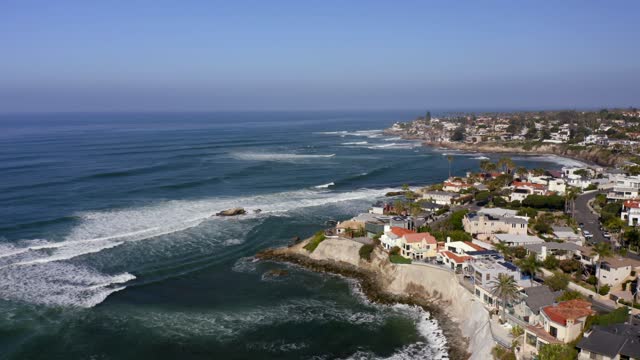 Aerial view of the cliffs, the surf and the ocean at Bird Rock.
