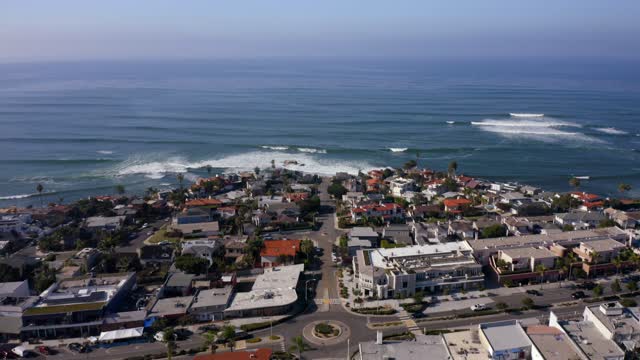 Aerial view of a residential street, the surf and the ocean at Bird Rock.