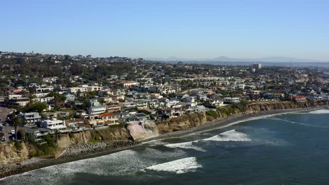 Aerial view of the cliffs, the surf and the ocean at Bird Rock.