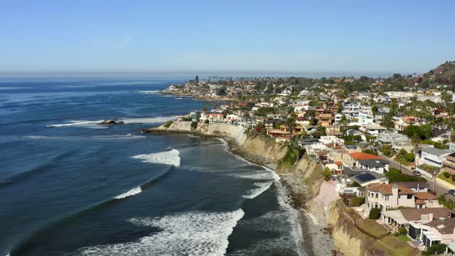Aerial view of the cliffs, the surf and the ocean at Bird Rock.