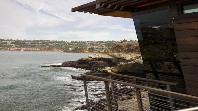 Elevated view of the cliffs, the ocean and homes at La Jolla Cove.
