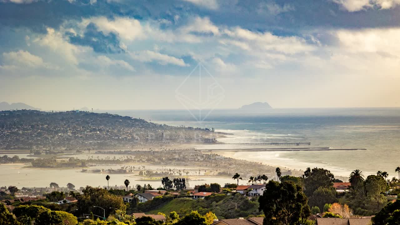 Elevated view of a residential street, the pier and palm trees at Mount Soledad.