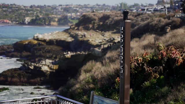Elevated view of the cliffs, the ocean and homes at La Jolla Cove.