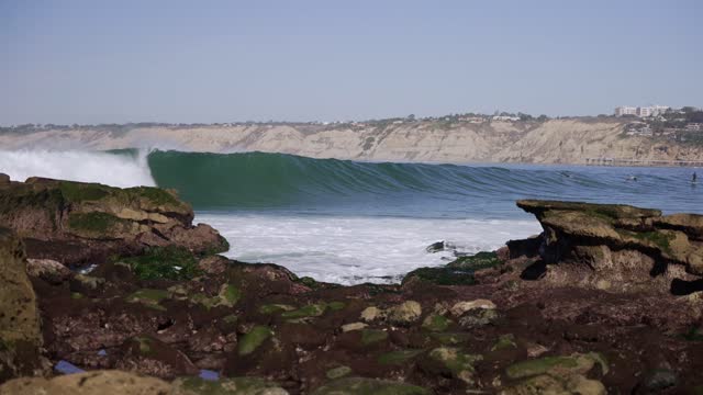 The cliffs, the surf and the ocean at La Jolla Cove.