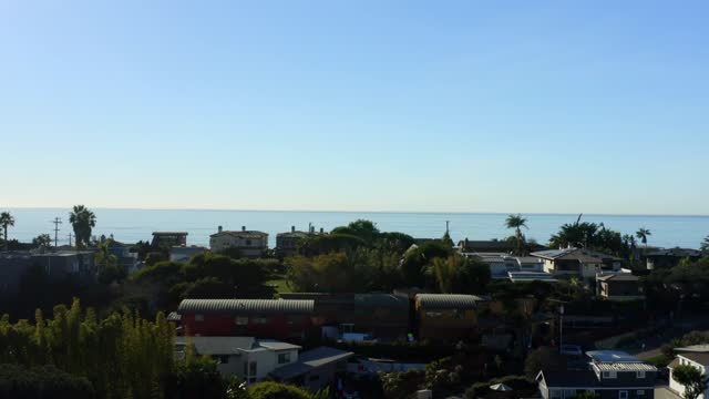 Elevated view of a residential street, palm trees and the ocean at Leucadia.