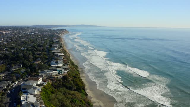 Aerial view of the cliffs, the surf and the ocean at Leucadia.