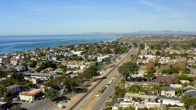 Aerial view of a residential street, the ocean and homes at Leucadia.
